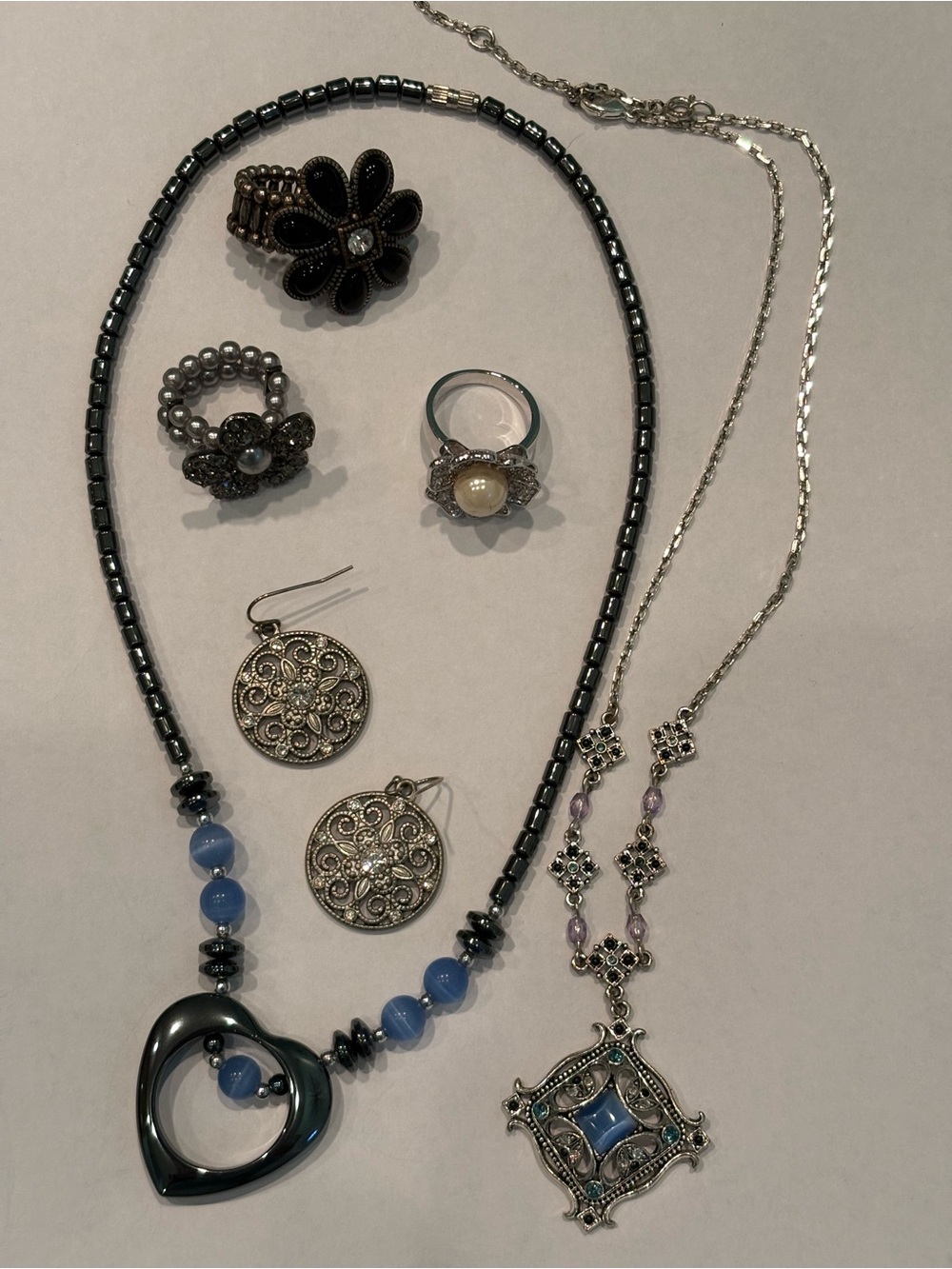 Women’s Costume Jewelry: 2 Pendant Necklaces, 3 Rings and Pair of Earrings